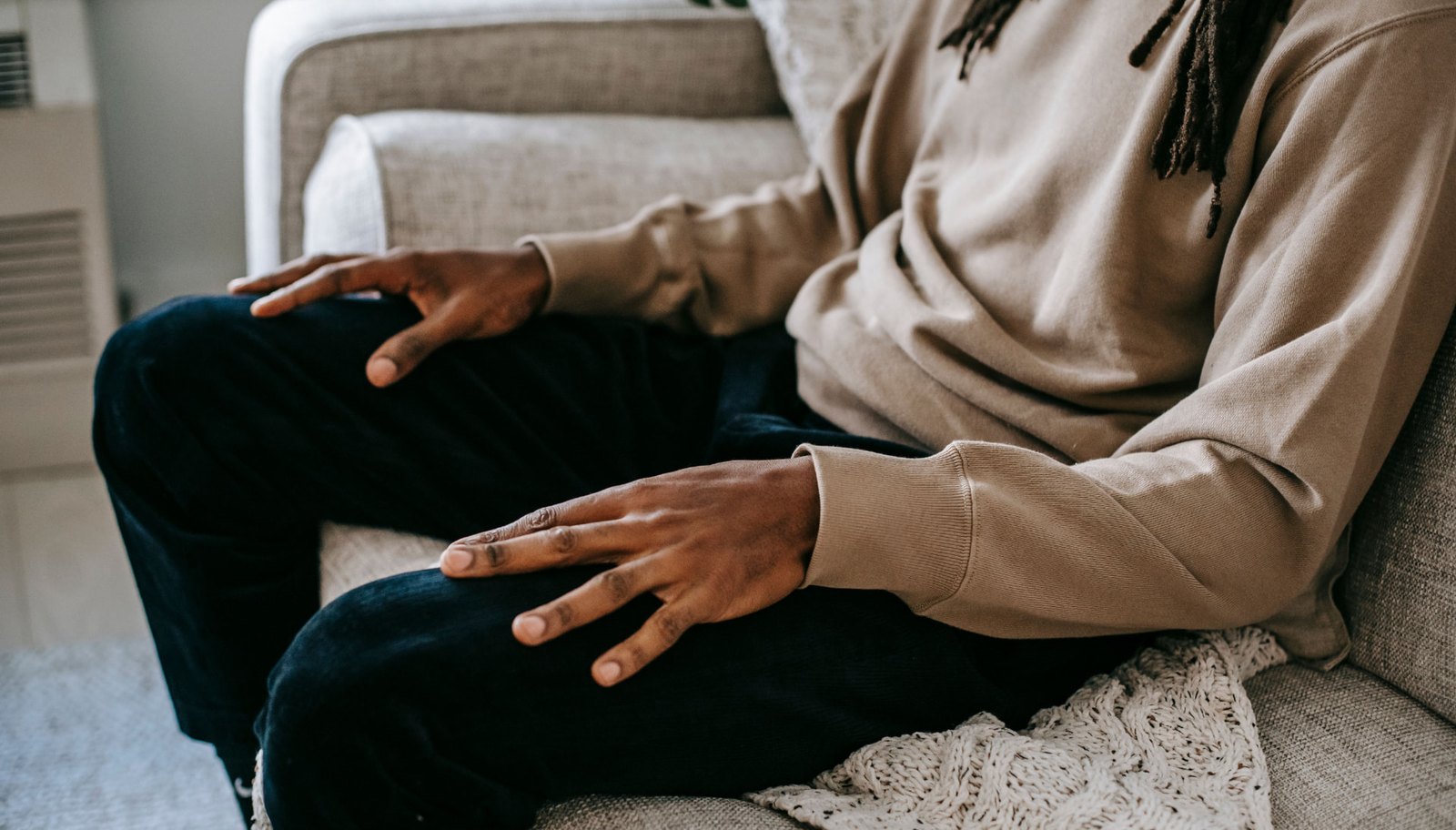 Local business owner sitting on a couch during a relaxed consultation