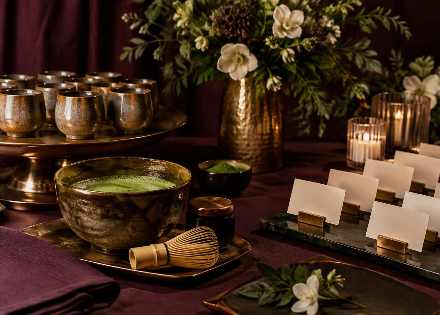 Styled matcha service table with ceramic cups, whisk and place cards